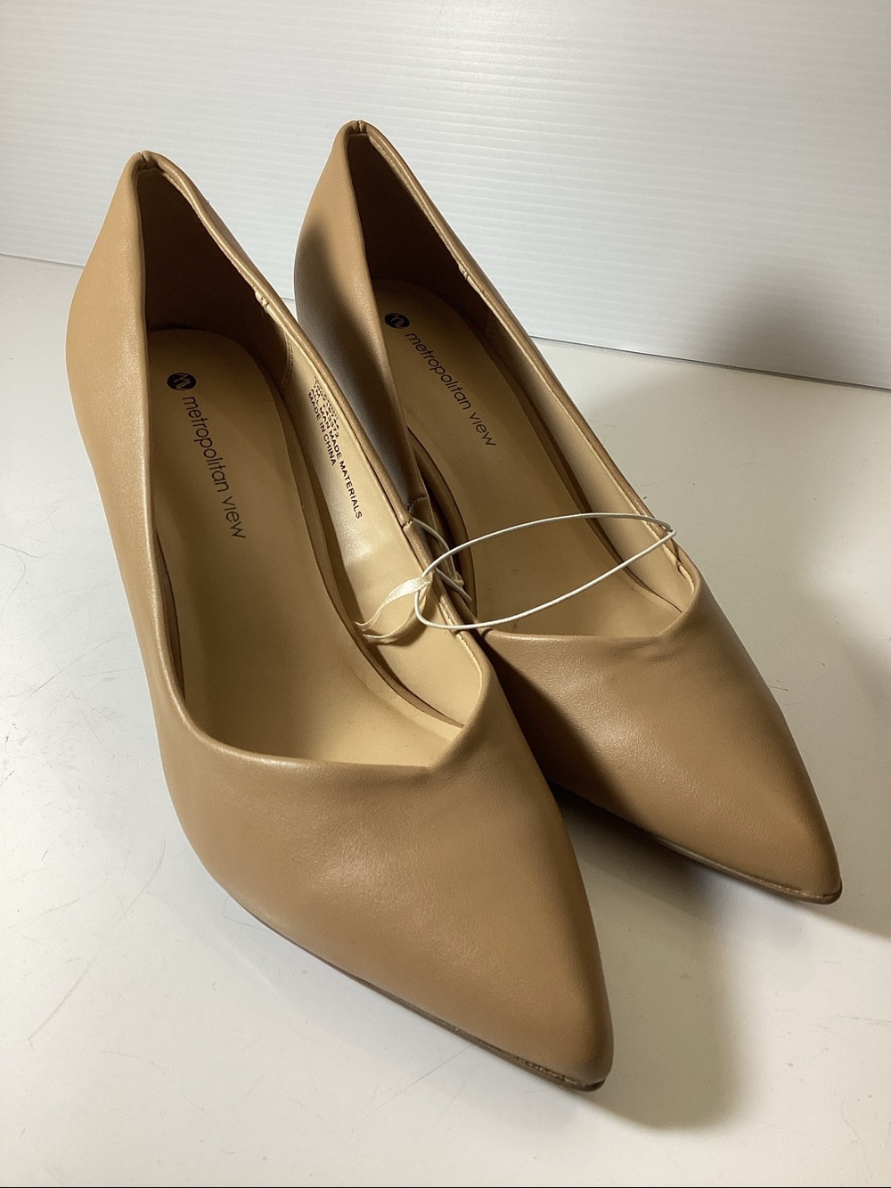 Women's beige leather pointed-toe pumps by Metropolitan View